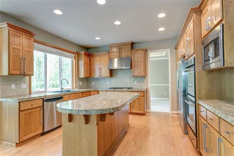 steel grey leathered with honey oak cabinets|honey oak cabinets blue.